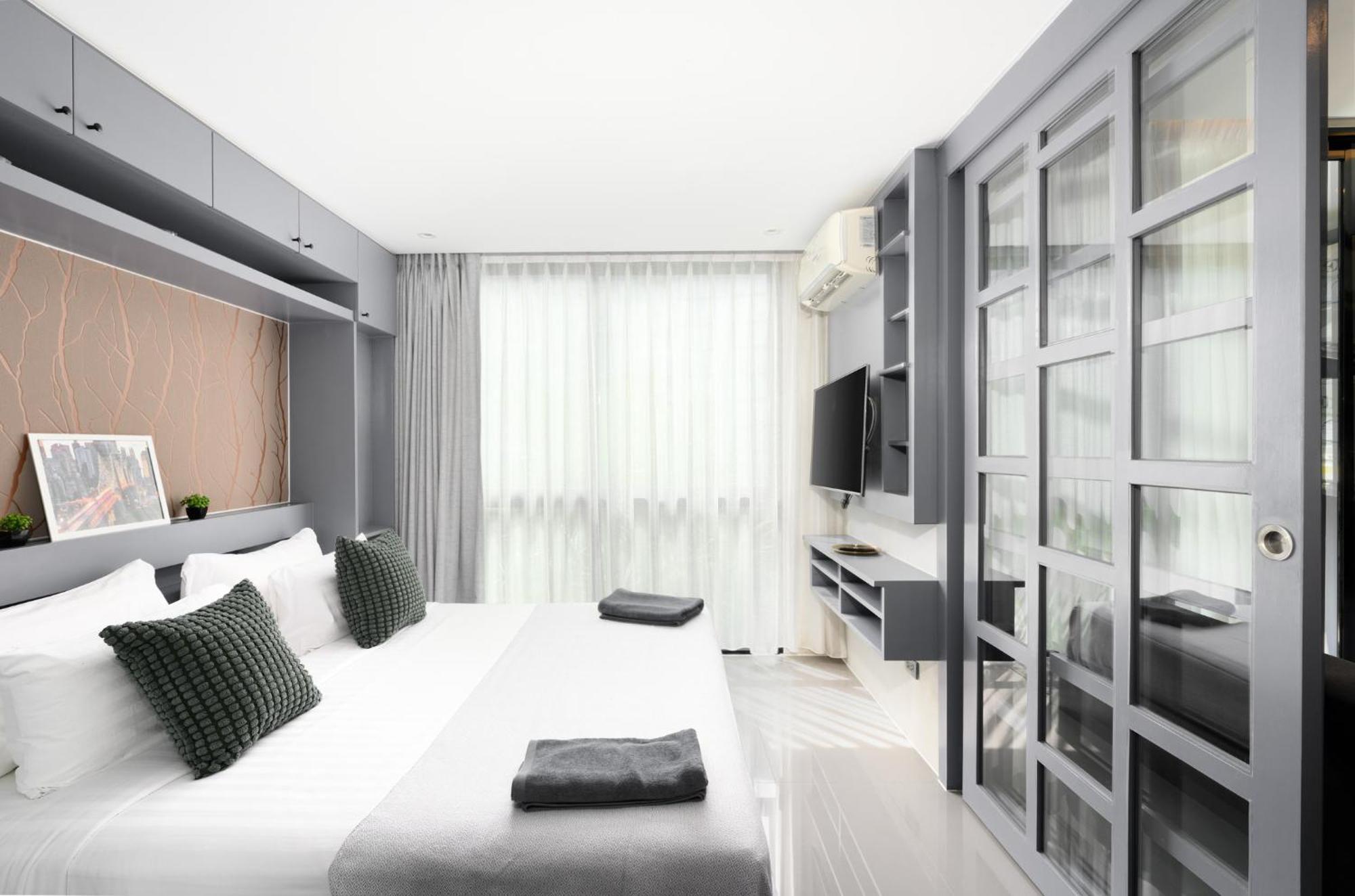 Apartment Sabay N303 With Scenic Pool View Surrounded By Palm Trees In Citygate Kamala Phuket